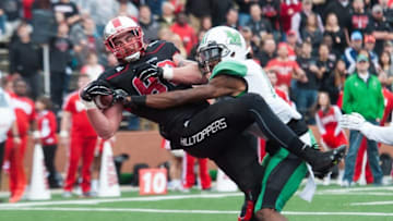Nov 27, 2015; Bowling Green, KY, USA; Western Kentucky Hilltoppers tight end Tyler Higbee (82) catches a pass to score a touchdown in front of Marshall Thundering Herd safety Taj Letman (17) during the first half at Houchens Industries-L.T. Smith Stadium. Mandatory Credit: Joshua Lindsey-USA TODAY Sports