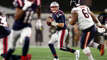 FOXBOROUGH, MASSACHUSETTS - OCTOBER 24: Mac Jones #10 of the New England Patriots looks to pass during the first half against the Chicago Bears at Gillette Stadium on October 24, 2022 in Foxborough, Massachusetts. (Photo by Adam Glanzman/Getty Images)
