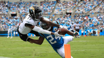 CHARLOTTE, NORTH CAROLINA - OCTOBER 06: James Bradberry #24 of the Carolina Panthers tries to stop D.J. Chark #17 of the Jacksonville Jaguars from getting in the end zone during their game at Bank of America Stadium on October 06, 2019 in Charlotte, North Carolina. (Photo by Streeter Lecka/Getty Images)