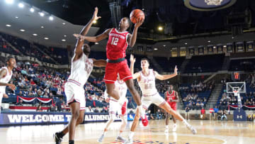 ANNAPOLIS, MD - NOVEMBER 11: Tramon Mark #12 of the Houston Cougars jumps to the basket over Ejike Obinna #50 of the Saint Joseph's Hawks during the Veterans Classic college basketball game at Alumni Hall on November 11, 2022 in Annapolis, Maryland. (Photo by Mitchell Layton/Getty Images)