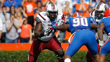Nov 15, 2014; Gainesville, FL, USA; South Carolina Gamecocks offensive tackle Brandon Shell (71) blocks Florida Gators defensive lineman Jonathan Bullard (90) during the second quarter at Ben Hill Griffin Stadium. Mandatory Credit: Kim Klement-USA TODAY Sports