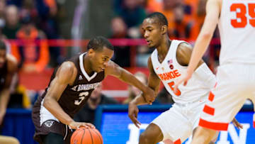 SYRACUSE, NY - DECEMBER 29: Alpha Okoli #3 of the St. Bonaventure Bonnies dribbles against Jalen Carey #5 of the Syracuse Orange during the second half at the Carrier Dome on December 29, 2018 in Syracuse, New York. Syracuse defeats St. Bonaventure 81-47. (Photo by Brett Carlsen/Getty Images)