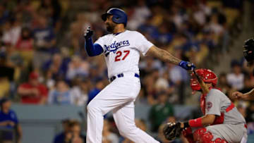 LOS ANGELES, CA - AUGUST 20: Matt Kemp #27 of the Los Angeles Dodgers singles as Francisco Pena #46 of the St. Louis Cardinals looks on during the fourth inning of a game at Dodger Stadium on August 20, 2018 in Los Angeles, California. (Photo by Sean M. Haffey/Getty Images)