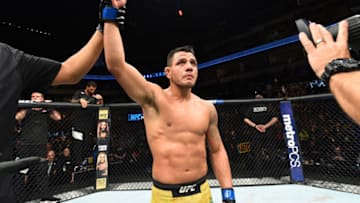 WINNIPEG, CANADA - DECEMBER 16: Rafael Dos Anjos of Brazil celebrates his victory over Robbie Lawler in their welterweight bout during the UFC Fight Night event at Bell MTS Place on December 16, 2017 in Winnipeg, Manitoba, Canada. (Photo by Josh Hedges/Zuffa LLC/Zuffa LLC via Getty Images)
