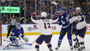 Feb 11, 2023; Toronto, Ontario, CAN; Columbus Blue Jackets forward Johnny Gaudreau (13) celebrates a goal by forward Boone Jenner (38) against Toronto Maple Leafs goaltender Joseph Woll (60) during the second period at Scotiabank Arena. Mandatory Credit: John E. Sokolowski-USA TODAY Sports