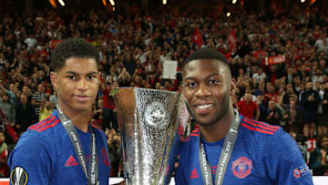 STOCKHOLM, SWEDEN - MAY 24: Marcus Rashford and Timothy Fosu-Mensah of Manchester United celebrate with the Europa League trophy after the UEFA Europa League Final match between Manchester United and Ajax at Friends Arena on May 24, 2017 in Stockholm, Sweden. (Photo by John Peters/Man Utd via Getty Images)