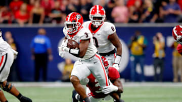 ATLANTA, GEORGIA - DECEMBER 04: Zamir White #3 of the Georgia Bulldogs carries the ball in the second quarter of the SEC Championship game against the Alabama Crimson Tide at Mercedes-Benz Stadium on December 04, 2021 in Atlanta, Georgia. (Photo by Todd Kirkland/Getty Images)