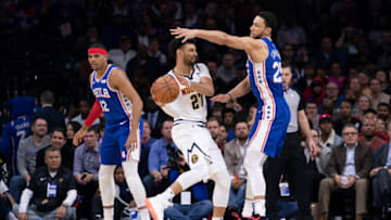 Jamal Murray of the Denver Nuggets controls the ball against Ben Simmons of the Philadelphia 76ers at the Wells Fargo Center on 10 Dec. 2019 in Philadelphia, Pennsylvania. (Photo by Mitchell Leff/Getty Images)