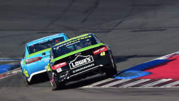 CHARLOTTE, NC - SEPTEMBER 30: Jimmie Johnson, driver of the #48 Lowe's for Pros Chevrolet, races Martin Truex Jr., driver of the #78 Auto-Owners Insurance Toyota, during the Monster Energy NASCAR Cup Series Bank of America Roval 400 at Charlotte Motor Speedway on September 30, 2018 in Charlotte, North Carolina. (Photo by Jared C. Tilton/Getty Images)