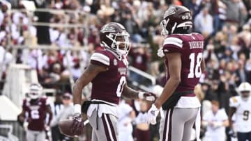 Nov 19, 2022; Starkville, Mississippi, USA; Mississippi State Bulldogs wide receiver Rara Thomas (0) reacts with wide receiver Justin Robinson (18) after a touchdown against the East Tennessee State Buccaneers during the first quarter at Davis Wade Stadium at Scott Field. Mandatory Credit: Matt Bush-USA TODAY Sports