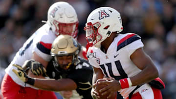 BOULDER, COLORADO - OCTOBER 05: Quarterback Khalil Tate #14 of the Arizona Wildcats carries the ball against the Colorado Buffaloes in the second quarter at Folsom Field on October 05, 2019 in Boulder, Colorado. (Photo by Matthew Stockman/Getty Images)