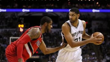 May 14, 2014; San Antonio, TX, USA; San Antonio Spurs forward Tim Duncan (left) hugs Portland Trail Blazers forward LaMarcus Aldridge (right) talk after game five of the second round of the 2014 NBA Playoffs at AT&T Center. The Spurs won 104-82. Mandatory Credit: Soobum Im-USA TODAY Sports