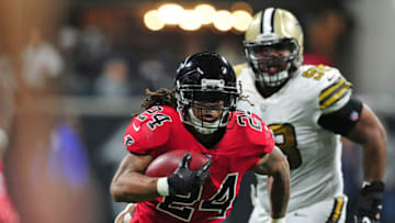 ATLANTA, GA - DECEMBER 7: Devonta Freeman #24 of the Atlanta Falcons carries the ball against the New Orleans Saints at Mercedes-Benz Stadium on December 7, 2017 in Atlanta, Georgia. (Photo by Scott Cunningham/Getty Images)