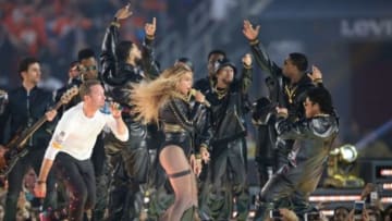 Feb 7, 2016; Santa Clara, CA, USA; Coldplay singer Chris Martin (left), recording artist Beyonce (center), and recording artist Bruno Mars performs during halftime between the Carolina Panthers and the Denver Broncos in Super Bowl 50 at Levi