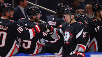 Dec 4, 2022; Buffalo, New York, USA; Buffalo Sabres right wing Jack Quinn (22) celebrates his second goal of the game with teammates during the third period against the San Jose Sharks at KeyBank Center. Mandatory Credit: Timothy T. Ludwig-USA TODAY Sports