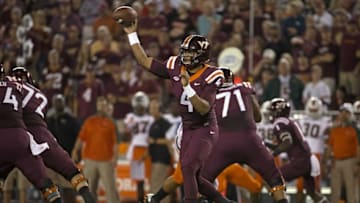 Oct 20, 2016; Blacksburg, VA, USA; Virginia Tech Hokies quarterback Jerod Evans (4) throws a pass during the first quarter against the Miami Hurricanes at Lane Stadium. Mandatory Credit: Peter Casey-USA TODAY Sports