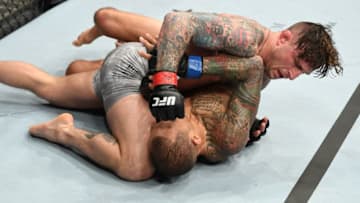 NEW YORK, NY - JANUARY 19: Gregor Gillespie (top) punches Yancy Medeiros in their lightweight bout during the UFC Fight Night event at the Barclays Center on January 19, 2019 in the Brooklyn borough of New York City. (Photo by Josh Hedges/Zuffa LLC/Zuffa LLC via Getty Images)