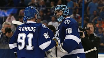 Mar 25, 2016; Tampa, FL, USA; Tampa Bay Lightning goalie Ben Bishop (30) and center Steven Stamkos (91) congratulate each other after they beat the New York Islanders at Amalie Arena. Tampa Bay Lightning defeated the New York Islanders 7-4. Mandatory Credit: Kim Klement-USA TODAY Sports
