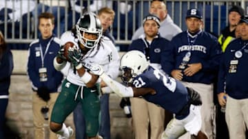 STATE COLLEGE, PA - OCTOBER 13: Felton Davis III #18 of the Michigan State Spartans catches a 25 yard touchdown pass in the fourth quarter against Amani Oruwariye #21 of the Penn State Nittany Lions on October 13, 2018 at Beaver Stadium in State College, Pennsylvania. (Photo by Justin K. Aller/Getty Images)