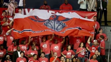 May 1, 2014; Atlanta, GA, USA; Atlanta Hawks fans hold up a Hawks flag in the game against the Indiana Pacers in game six of the first round of the 2014 NBA Playoffs at Philips Arena. The Indiana Pacers defeated the Atlanta Hawks 95-88. Mandatory Credit: Jason Getz-USA TODAY Sports