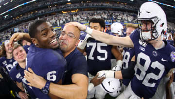 ARLINGTON, TEXAS - DECEMBER 28: Head coach James Franklin of the Penn State Nittany Lions celebrates with Cam Brown #6 of the Penn State Nittany Lions after the Nittany Lions beat the Memphis Tigers 53-39 at AT&T Stadium on December 28, 2019 in Arlington, Texas. (Photo by Tom Pennington/Getty Images)