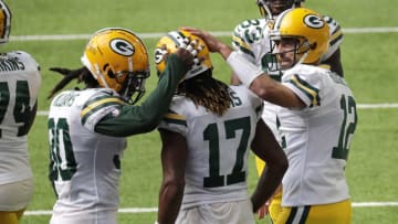 Green Bay Packers wide receiver Davante Adams (17) celebrates his second touchdown with teammates Jamaal Williams (30) and Aaron Rodgers (12) during their football game Sunday, Sept. 13, 2020, at U.S. Bank Stadium in Minneapolis, Minn. Green Bay won 43-34.Apc Packersvsvikings 0913202707