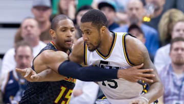 Mar 8, 2016; Salt Lake City, UT, USA; Atlanta Hawks center Al Horford (15) defends against Utah Jazz forward Derrick Favors (15) during the second half at Vivint Smart Home Arena. Atlanta won 91-84. Mandatory Credit: Russ Isabella-USA TODAY Sports
