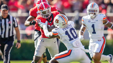 Auburn footballOct 8, 2022; Athens, Georgia, USA; Georgia Bulldogs running back Daijun Edwards (30) runs against Auburn Tigers safety Zion Puckett (10) during the first quarter at Sanford Stadium. Mandatory Credit: Dale Zanine-USA TODAY Sports