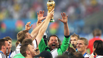 RIO DE JANEIRO, BRAZIL - JULY 13: Per Mertesacker of Germany holds the trophy a loft during the 2014 World Cup final match between Germany and Argentina at The Maracana Stadium on July 13, 2014 in Rio de Janeiro, Brazil. (Photo by Ian MacNicol/Getty Images)