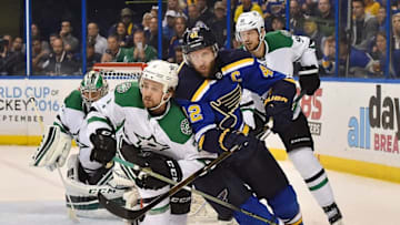 May 9, 2016; St. Louis, MO, USA; Dallas Stars defenseman Kris Russell (2) and St. Louis Blues center David Backes (42) battle for position on the Ice during the second period in game six of the second round of the 2016 Stanley Cup Playoffs at Scottrade Center. Mandatory Credit: Jasen Vinlove-USA TODAY Sports