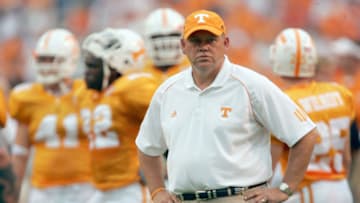 KNOXVILLE, TN - SEPTEMBER 9: Head coach Phillip Fullmer of the University of Tennessee Volunteers stands on the field with his team after pre-game warmups before the game with the Air Force Academy Falcons on September 9, 2006 at Neyland Stadium in Knoxville, Tennessee. Tennessee won 31-30. (Photo by Stephen Dunn/Getty Images)