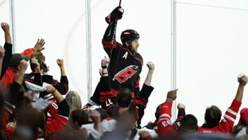 RALEIGH, NORTH CAROLINA - OCTOBER 11: Jaccob Slavin #74 of the Carolina Hurricanes reacts after scoring a goal against the Ottawa Senators during the third period of their season opener at PNC Arena on October 11, 2023 in Raleigh, North Carolina. The Hurricanes won 5-3. (Photo by Grant Halverson/Getty Images)