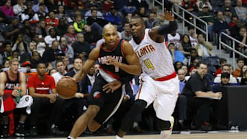 Dec 21, 2015; Atlanta, GA, USA; Portland Trail Blazers guard Gerald Henderson (9) drives on Atlanta Hawks forward Paul Millsap (4) in the first quarter at Philips Arena. Mandatory Credit: Brett Davis-USA TODAY Sports