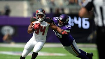 MINNEAPOLIS, MN - SEPTEMBER 24: Charles Sims #34 of the Tampa Bay Buccaneers is tackled with the ball by defender Anthony Barr #55 of the Minnesota Vikings in the second half of the game on September 24, 2017 at U.S. Bank Stadium in Minneapolis, Minnesota. (Photo by Hannah Foslien/Getty Images)