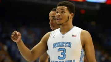Nov 18, 2015; Chapel Hill, NC, USA; North Carolina Tar Heels forward Kennedy Meeks (3) gets encouragement from forward Brice Johnson (11) before shooting a free throw during the second half against the Wofford Terriers at Dean E. Smith Center. North Carolina won 78-58. Mandatory Credit: Rob Kinnan-USA TODAY Sports