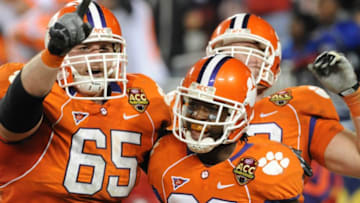 TAMPA, FL - NOVEMBER 28: Running back Andre Ellington #23 of the Clemson Tigers celebrates a touchdown run with guard Thomas Austin #65 against the Georgia Tech Yellow Jackets in the 2009 ACC Football Championship Game December 5, 2009 at Raymond James Stadium in Tampa, Florida. (Photo by Al Messerschmidt/Getty Images)