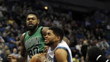 Feb 22, 2016; Minneapolis, MN, USA; Minnesota Timberwolves forward Karl Anthony Towns (32) drives to the basket guarded by Boston Celtics forward Amir Johnson (90) in the second quarter at Target Center. The Wolves win 124-122 over the Celtics. Mandatory Credit: Marilyn Indahl-USA TODAY Sports