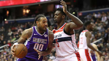 WASHINGTON, DC - MARCH 11: Willie Cauley-Stein #00 of the Sacramento Kings drives to the basket against Bobby Portis #5 of the Washington Wizards in the first half at Capital One Arena on March 11, 2019 in Washington, DC. NOTE TO USER: User expressly acknowledges and agrees that, by downloading and or using this photograph, User is consenting to the terms and conditions of the Getty Images License Agreement. (Photo by Rob Carr/Getty Images)