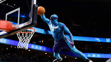 Dec 20, 2016; Charlotte, NC, USA; Charlotte Hornets mascot Super Hugo dunks the ball during a timeout in the second half against the Los Angeles Lakers at Spectrum Center. The Hornets defeated the Lakers 117-113. Mandatory Credit: Jeremy Brevard-USA TODAY Sports