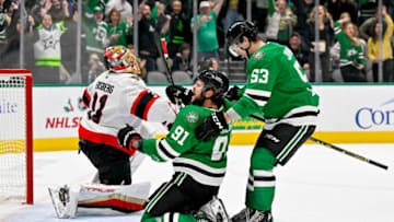 Dec 8, 2022; Dallas, Texas, USA; Dallas Stars center Tyler Seguin (91) and center Wyatt Johnston (53) celebrates Seguin scoring the game winning goal against Ottawa Senators goaltender Anton Forsberg (31) during the overtime period at the American Airlines Center. Mandatory Credit: Jerome Miron-USA TODAY Sports