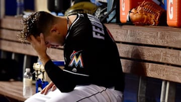 Jul 22, 2016; Miami, FL, USA; Miami Marlins starting pitcher Jose Fernandez (16) reacts in the dugout during the first inning against the New York Mets at Marlins Park. Mandatory Credit: Steve Mitchell-USA TODAY Sports