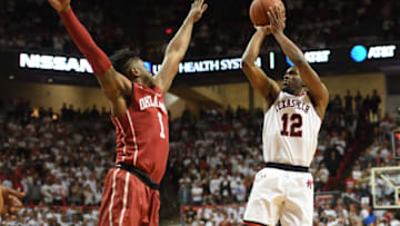 LUBBOCK, TX - FEBRUARY 13: Keenan Evans #12 of the Texas Tech Red Raiders shoots the ball over Rashard Odomes #1 of the Oklahoma Sooners during the second half of the game on February 13, 2018 at United Supermarket Arena in Lubbock, Texas. Texas Tech defeated Oklahoma 88-78. (Photo by John Weast/Getty Images)