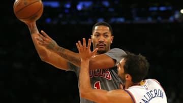 Dec 19, 2015; New York, NY, USA; Chicago Bulls guard Derrick Rose (1) looks to pass against New York Knicks guard Jose Calderon (3) during second half at Madison Square Garden. The New York Knicks defeated the Chicago Bulls 107-91. Mandatory Credit: Noah K. Murray-USA TODAY Sports