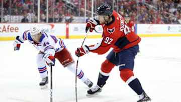 WASHINGTON, DC - OCTOBER 17: Evgeny Kuznetsov #92 of the Washington Capitals shoots the puck past Neal Pionk #44 of the New York Rangers during the third period at Capital One Arena on October 17, 2018 in Washington, DC. (Photo by Will Newton/Getty Images)