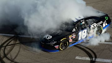 LAS VEGAS, NV - MARCH 02: Kyle Busch, driver of the #18 Extreme Concepts/iK9 Toyota, celebrates after winning the NASCAR Xfinty Series Boyd Gaming 300 at Las Vegas Motor Speedway on March 2, 2019 in Las Vegas, Nevada. (Photo by Robert Laberge/Getty Images)