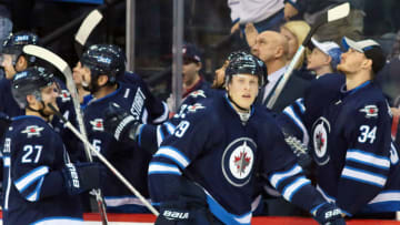 Nov 29, 2016; Winnipeg, Manitoba, CAN; Winnipeg Jets right wing Patrik Laine (29) celebrates his goal with teammates during the third period against the New Jersey Devils at MTS Centre. Winnipeg Jets win 3-2. Mandatory Credit: Bruce Fedyck-USA TODAY Sports
