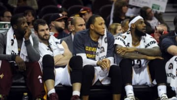 Dec 28, 2014; Cleveland, OH, USA; Cleveland Cavaliers guard Dion Waiters (3) and Cleveland Cavaliers forward Kevin Love (0) and Cleveland Cavaliers forward Shawn Marion (31) and Cleveland Cavaliers forward LeBron James (23) sit on the bench during the fourth quarter against the Detroit Pistons at Quicken Loans Arena. The Pistons won 103-80. Mandatory Credit: Ken Blaze-USA TODAY Sports