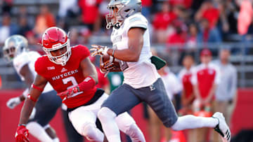 PISCATAWAY, NJ - SEPTEMBER 09: Sergio Bailey II #2 of the Eastern Michigan Eagles runs past Kiy Hester #2 of the Rutgers Scarlet Knights after making a catch during the third quarter of a game on September 9, 2017 in Piscataway, New Jersey. Eastern Michigan defeated Rutgers 16-13. (Photo by Rich Schultz/Getty Images)