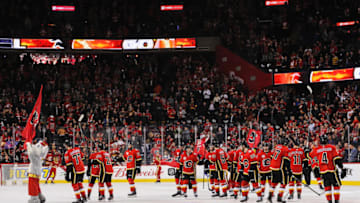 CALGARY, AB - MARCH 4: The Calgary Flames salute the crowd after defeating the Columbus Blue Jackets in overtime during an NHL game at Scotiabank Saddledome on March 4, 2020 in Calgary, Alberta, Canada. (Photo by Derek Leung/Getty Images)