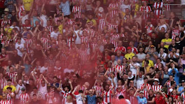 Brentford fans - English Premier League (Photo by ADRIAN DENNIS/AFP via Getty Images)